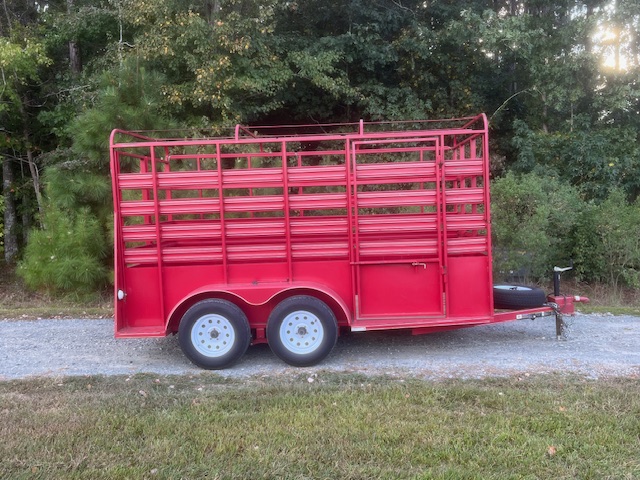 6 x 12 Livestock trailer with red metal railings for transporting animals